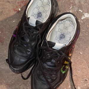 This is another Gucci sneakers it’s been worn and has some scuffs on them.